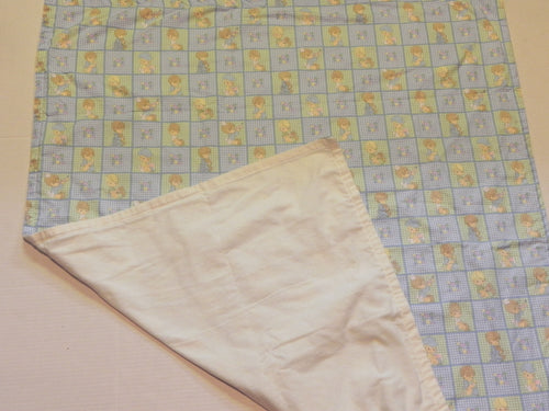 Blue-and-white children’s print baby blanket with white flannel backing