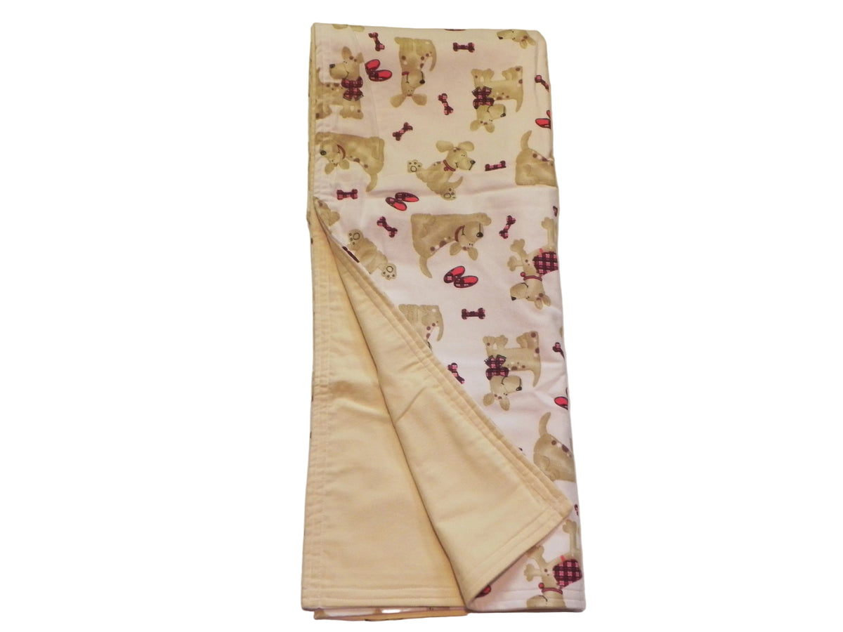 Puppy print flannel baby blanket showing light yellow backing