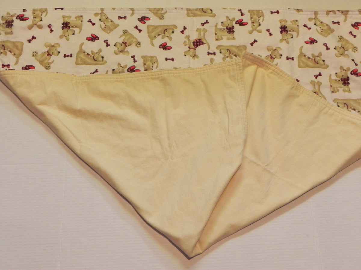 Puppy print flannel baby blanket with light yellow flannel backing